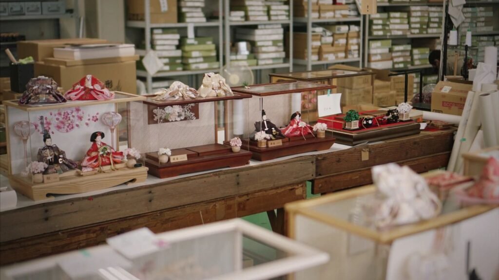 Display of traditional dolls in a workshop setting.