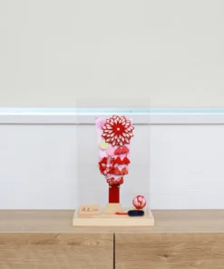 Hagoita paddle with red floral decorations. Wholesale by Fujiki Crafts.