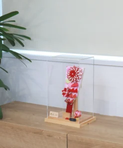 Hagoita paddle with red floral decorations. Wholesale by Fujiki Crafts.
