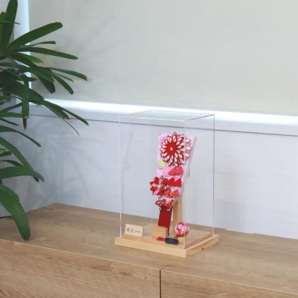 Hagoita paddle with red floral decorations. Wholesale by Fujiki Crafts.