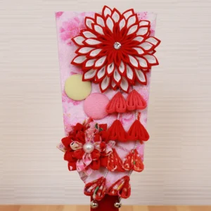 Hagoita paddle with red floral decorations. Wholesale by Fujiki Crafts.