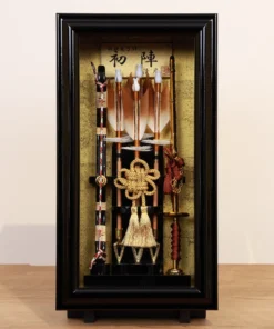 Traditional Japanese Hamaya arrow display with golden accents in black case, for cultural decor and protective gift sets. Wholesale by Fujiki Crafts.