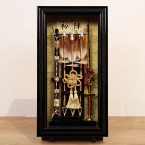 Traditional Japanese Hamaya arrow display with golden accents in black case, for cultural decor and protective gift sets. Wholesale by Fujiki Crafts.