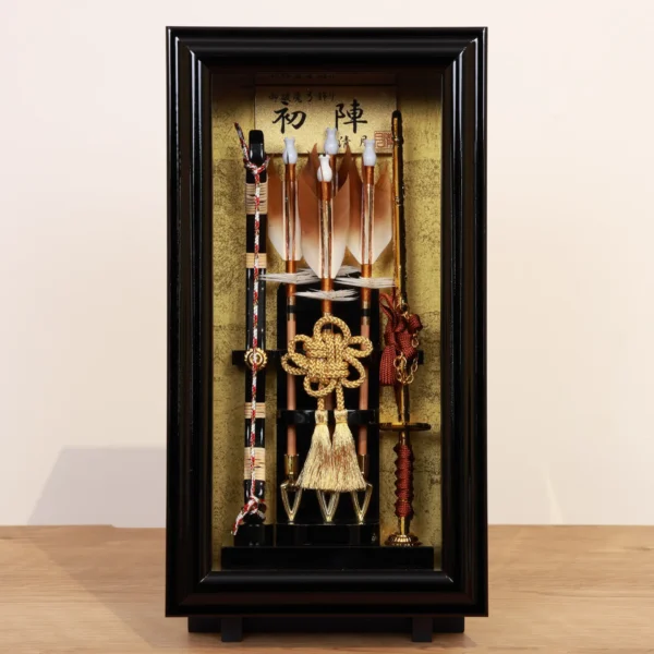 Traditional Japanese Hamaya arrow display with golden accents in black case, for cultural decor and protective gift sets. Wholesale by Fujiki Crafts.