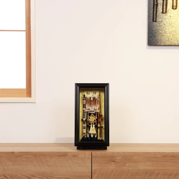 Traditional Japanese Hamaya arrow display with golden accents in black case, for cultural decor and protective gift sets. Wholesale by Fujiki Crafts.