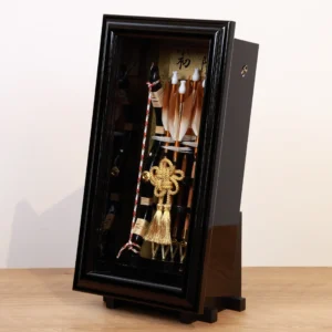 Traditional Japanese Hamaya arrow display with golden accents in black case, for cultural decor and protective gift sets. Wholesale by Fujiki Crafts.