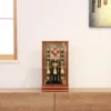 Japanese Hamaya arrow display with gold cord tassels and feathered arrows in a wooden frame case, set against a gold textured backdrop. Wholesale by Fujiki Crafts.