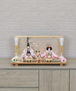 Hina doll set with wooden glass backdrop with cherry blossom and seasonal ornaments. Wholesale by Fujiki crafts.