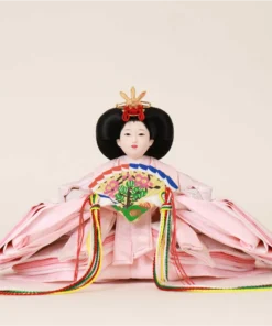 Empress Hina doll in layered pink kimono with floral fan. Wholesale by Fujiki crafts.