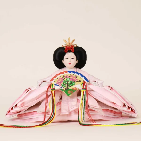 Empress Hina doll in layered pink kimono with floral fan. Wholesale by Fujiki crafts.