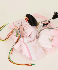 Empress Hina doll in layered pink kimono with floral fan. Wholesale by Fujiki crafts.