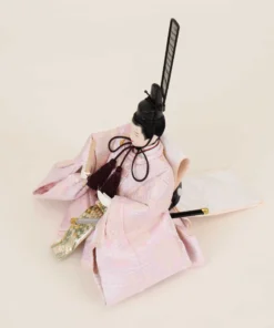 Emperor Hina doll in light pink silk kimono with fan and sword. Wholesale by Fujiki crafts.