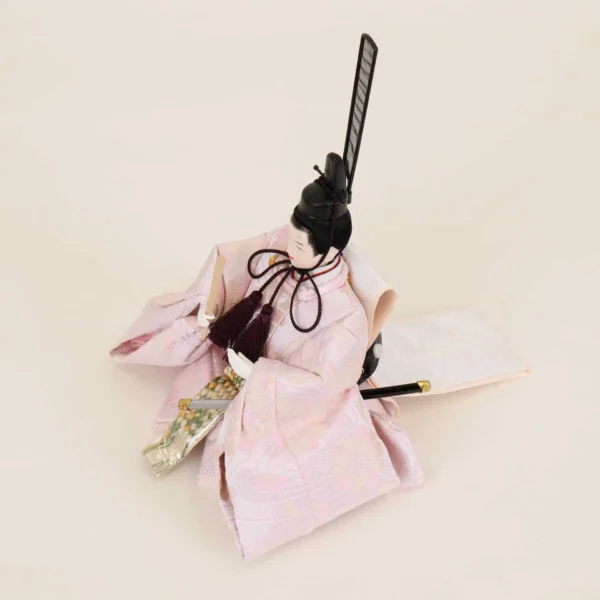 Emperor Hina doll in light pink silk kimono with fan and sword. Wholesale by Fujiki crafts.