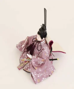 Emperor Hina doll in purple silk kimono with fan and sword. Wholesale by Fujiki crafts.