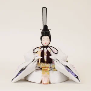 Emperor Hina doll in white patterned kimono with gold and purple accents, holding a ceremonial baton. Wholesale by Fujiki Crafts.