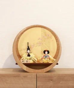 Circular Japanese Hina doll display with cherry blossom screen. Wholesale by Fujiki Crafts.