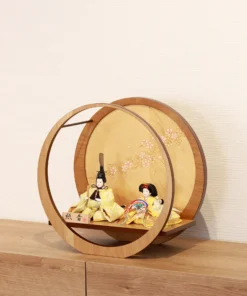 Circular Japanese Hina doll display with cherry blossom screen. Wholesale by Fujiki Crafts.