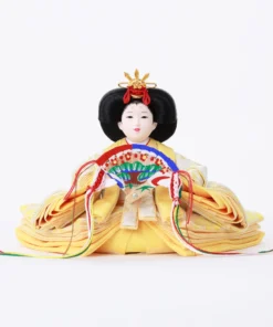 Empress Hina doll in layered yellow kimono with fan. Wholesale by Fujiki Crafts.