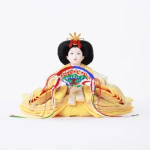 Empress Hina doll in layered yellow kimono with fan. Wholesale by Fujiki Crafts.