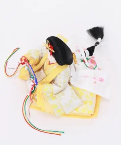 Empress Hina doll in layered yellow kimono with fan. Wholesale by Fujiki Crafts.