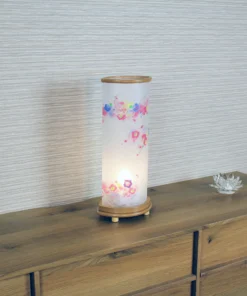 Handcrafted Japanese Chouchin lantern with plum blossom washi paper and wooden base. Wholesale by Fujiki Crafts.