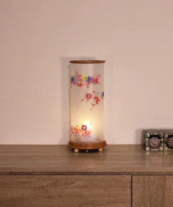 Handcrafted Japanese Chouchin lantern with plum blossom washi paper and wooden base. Wholesale by Fujiki Crafts.