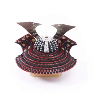 Traditional Kabuto samurai helmet with silver crest, mounted on a dark wood base, flanked by miniature sword and arrow display. Wholesale by Fujiki Crafts.