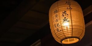 Japanese lantern glowing softly at twilight.
