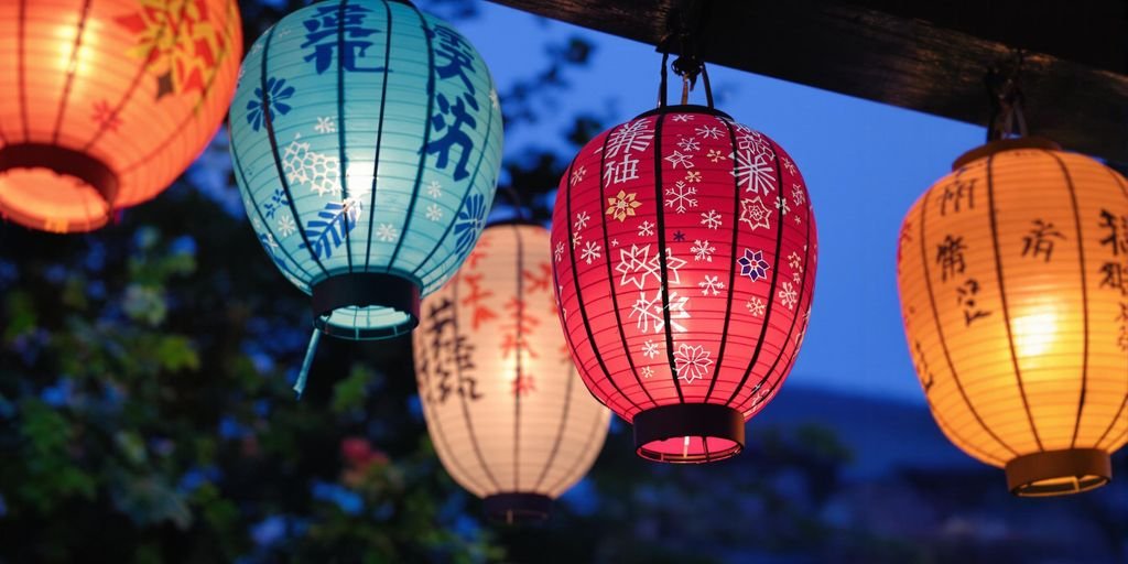 Japanese lanterns glowing at dusk